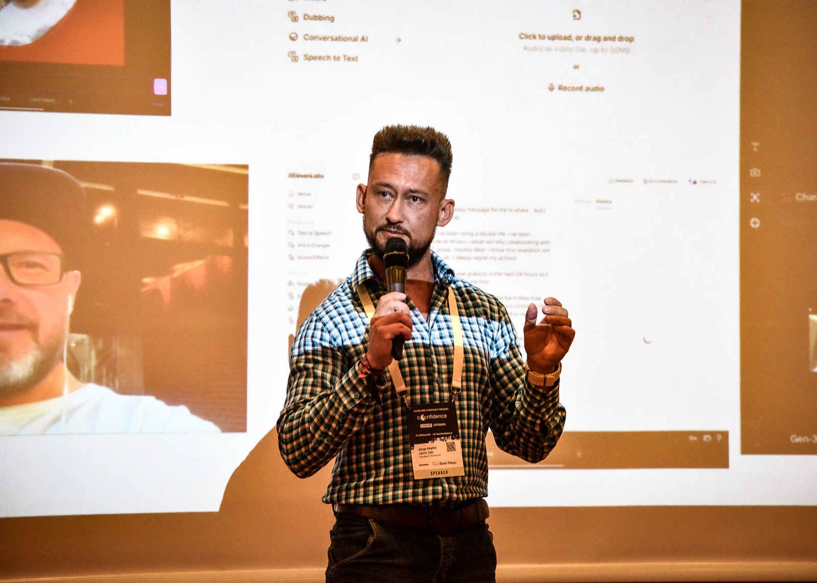 Jorge speaking at Confidence Conference 2025 with deepfake demo behind him
